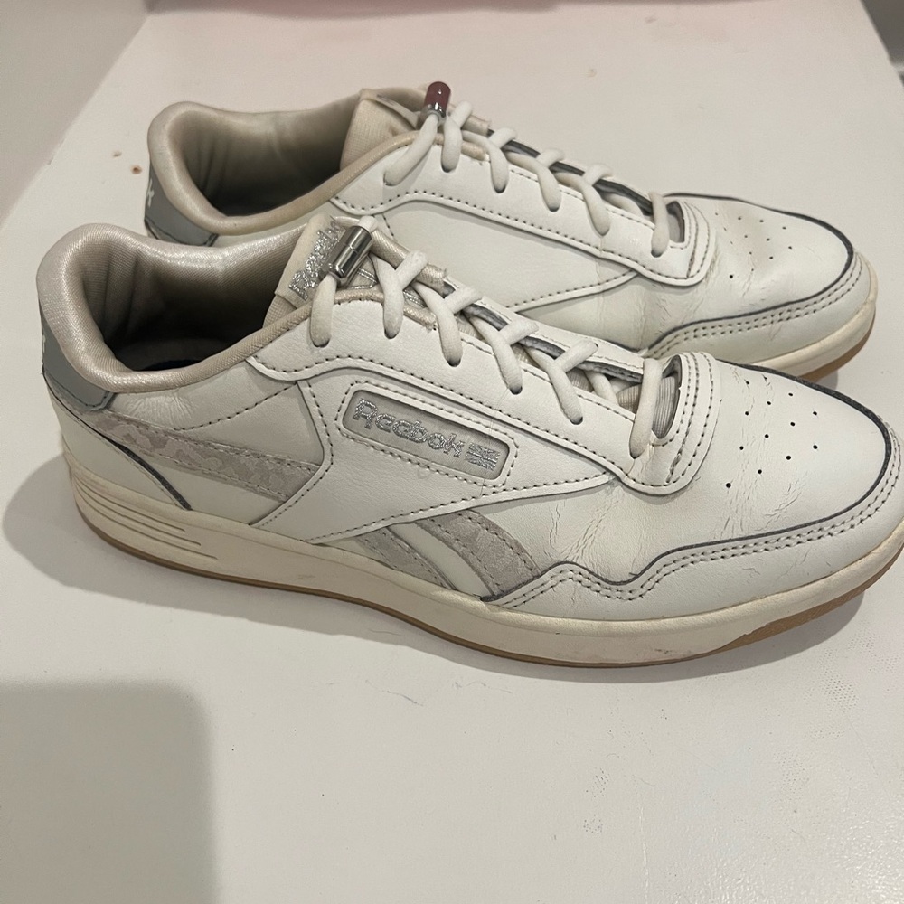 White Reebok ladies sneakers.